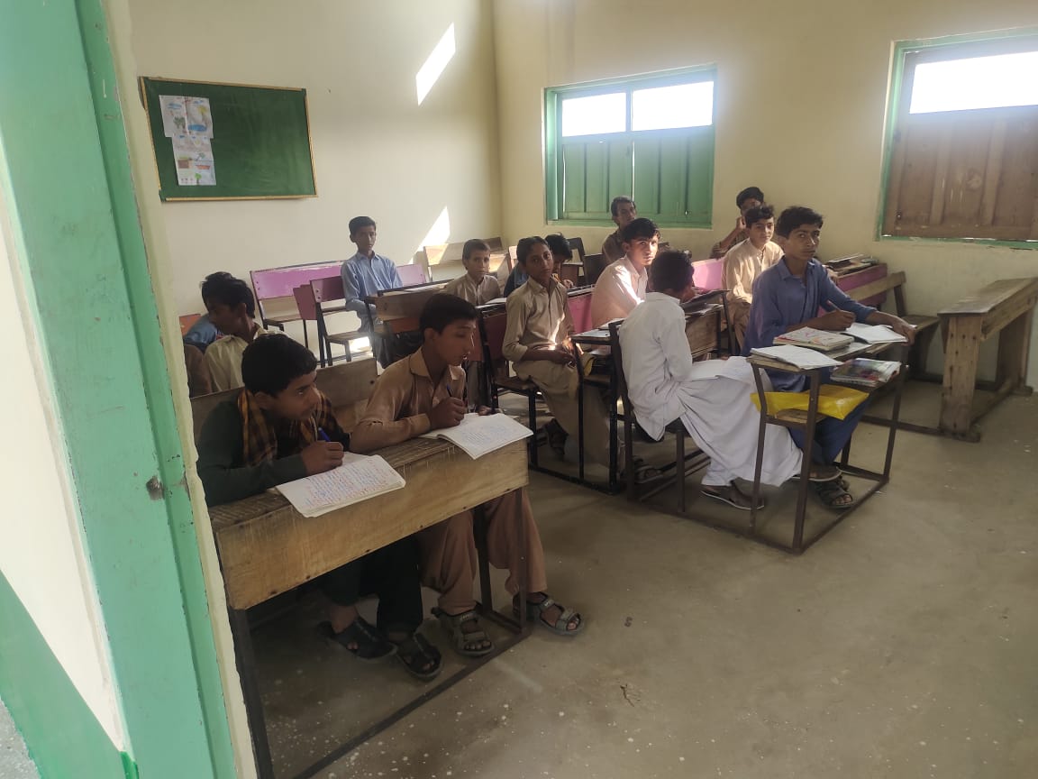 Students working in their notebooks at their desks